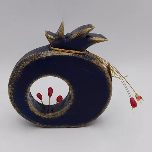 Blue wooden pomegranate